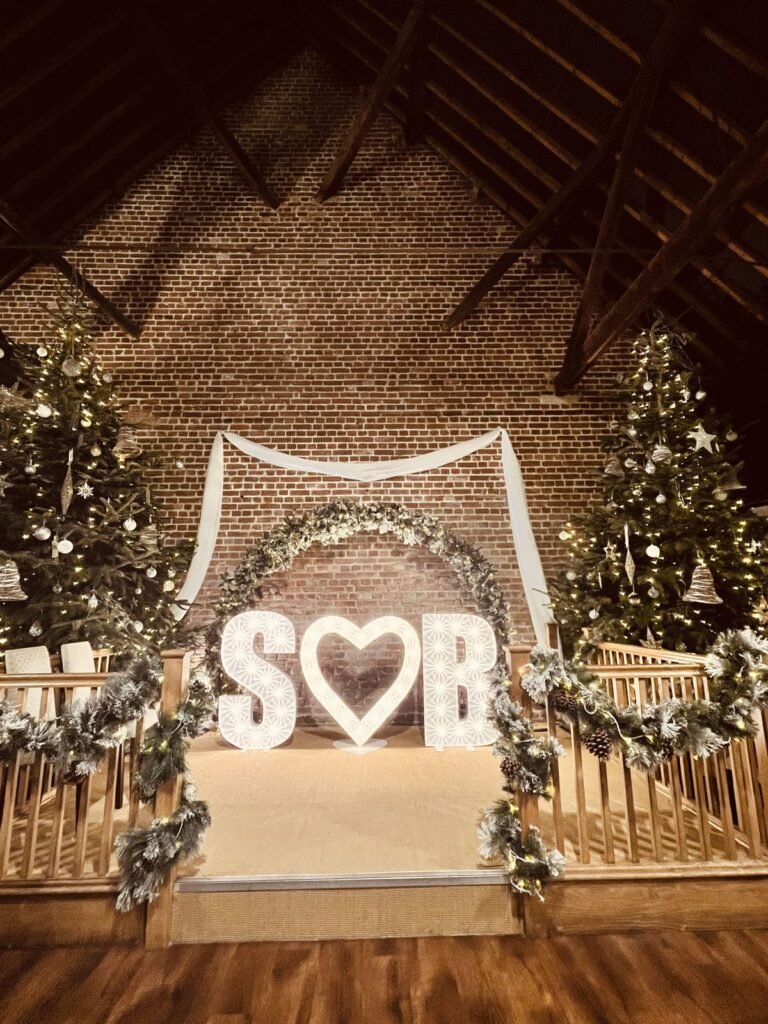 Illuminated initials and heart on the balcony at Cooling Castle Barn
